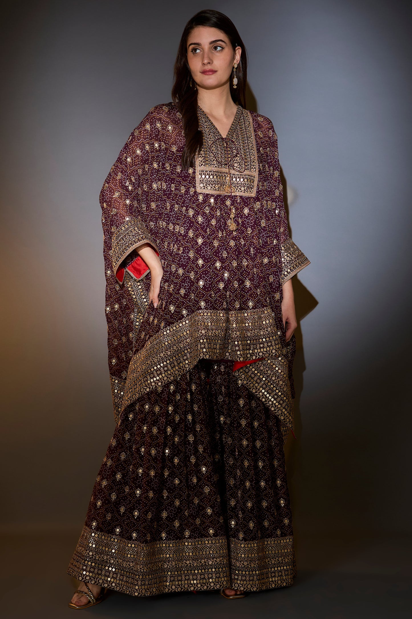 wine kaftan with sharara with intricate aari and sequins work on the neck ghera and bottom