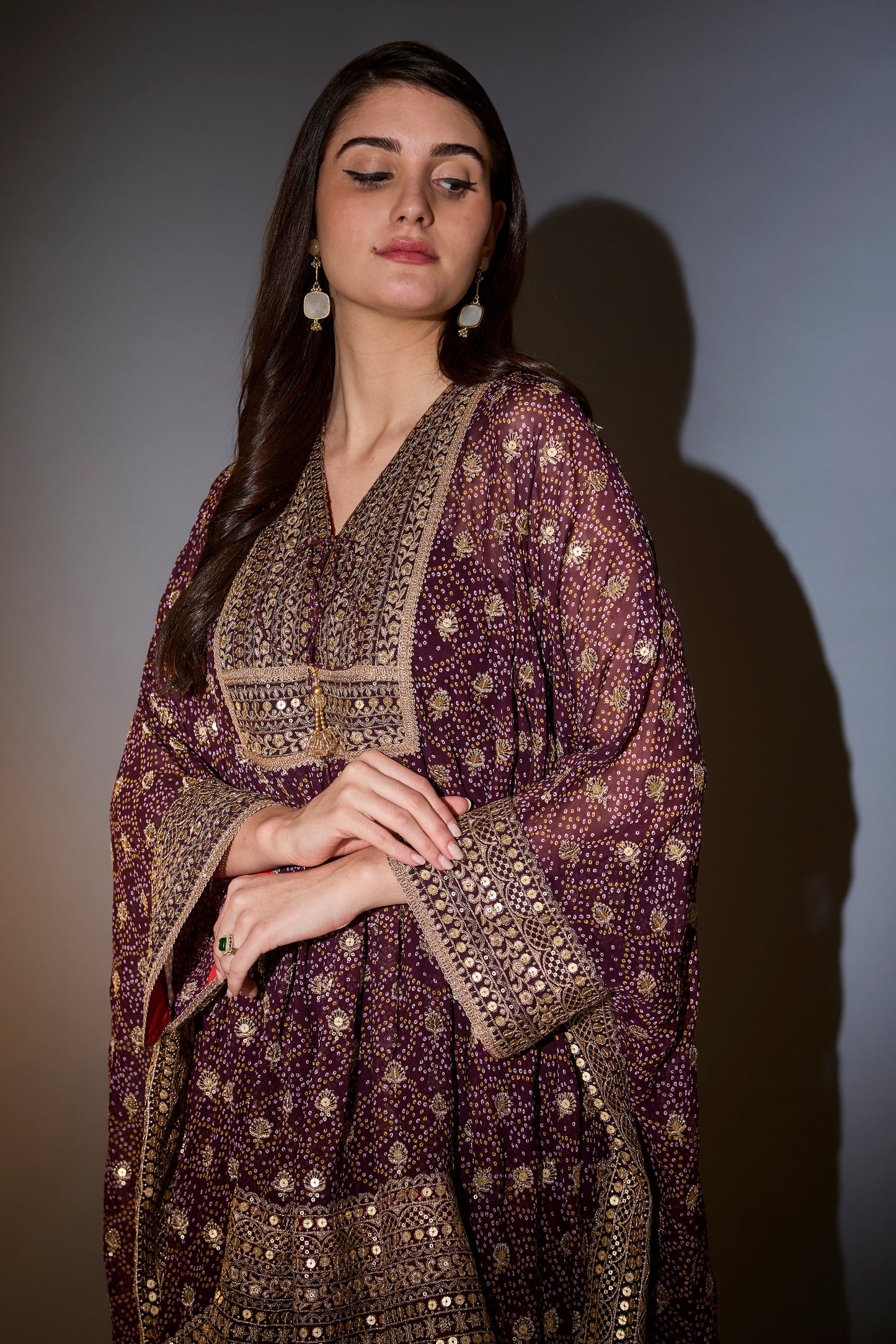 wine kaftan with sharara with intricate aari and sequins work on the neck ghera and bottom