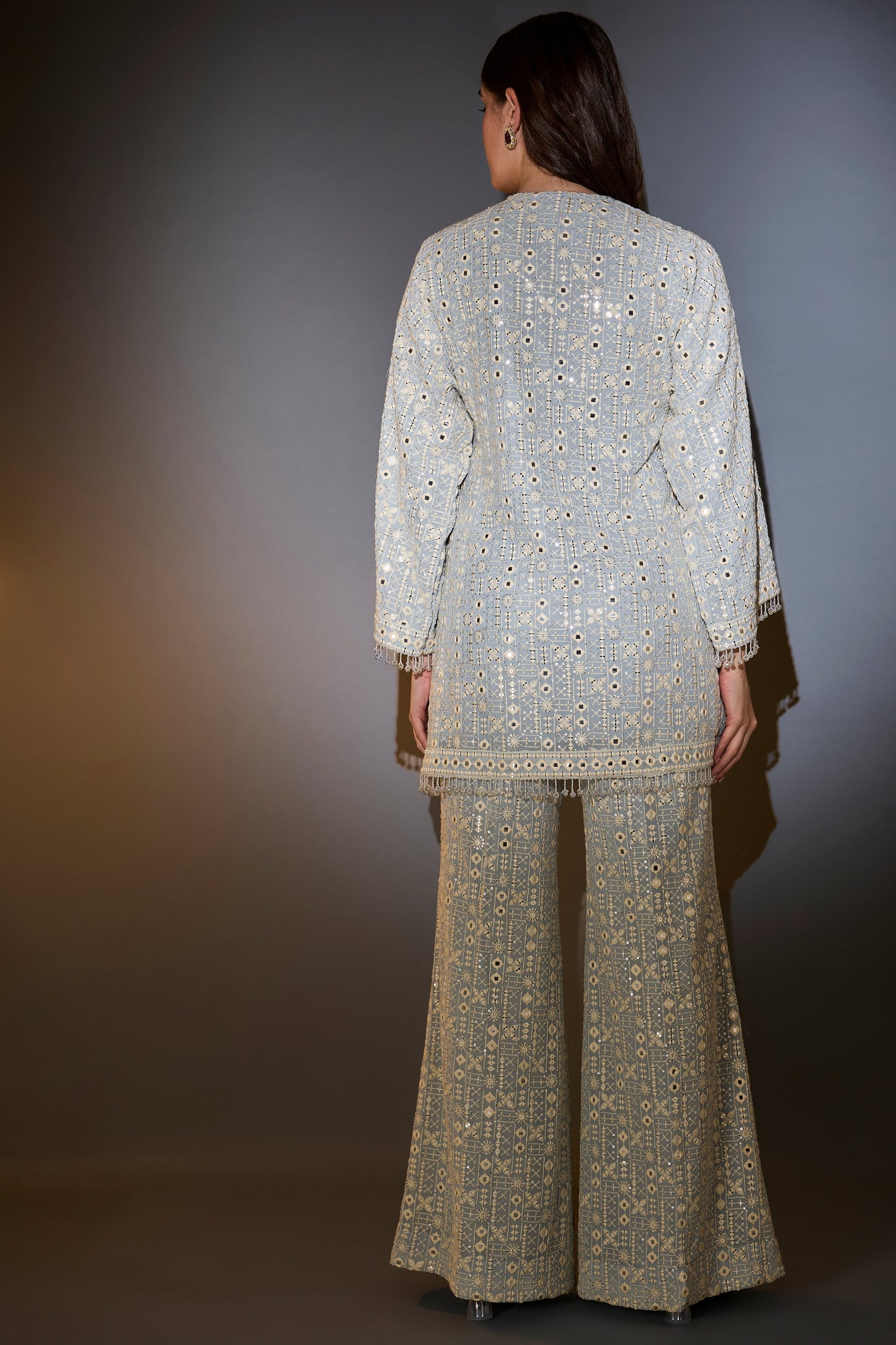 powder blue co ord set with thread mirror and sequin work with detailed edgings embellished tassles