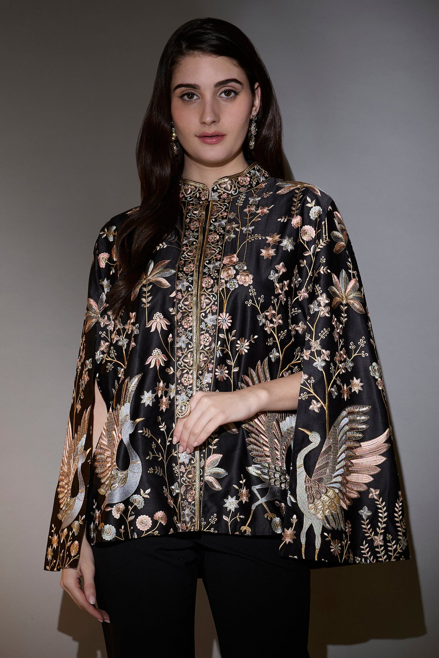 black cape with intricate multi thread work elevated by swan motifs