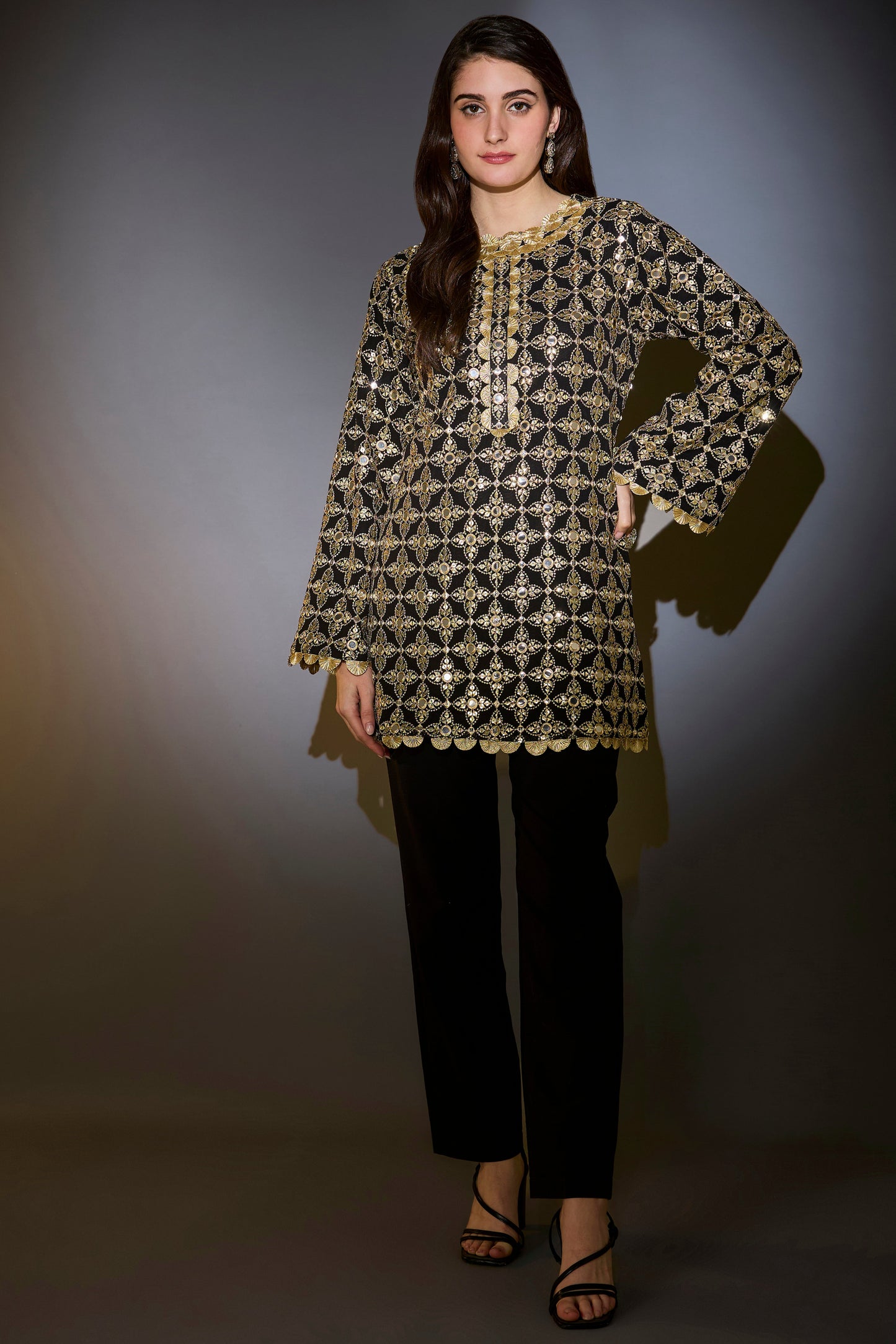 heavy black tunic with intricate mirror and zari work with detailed gota edgings