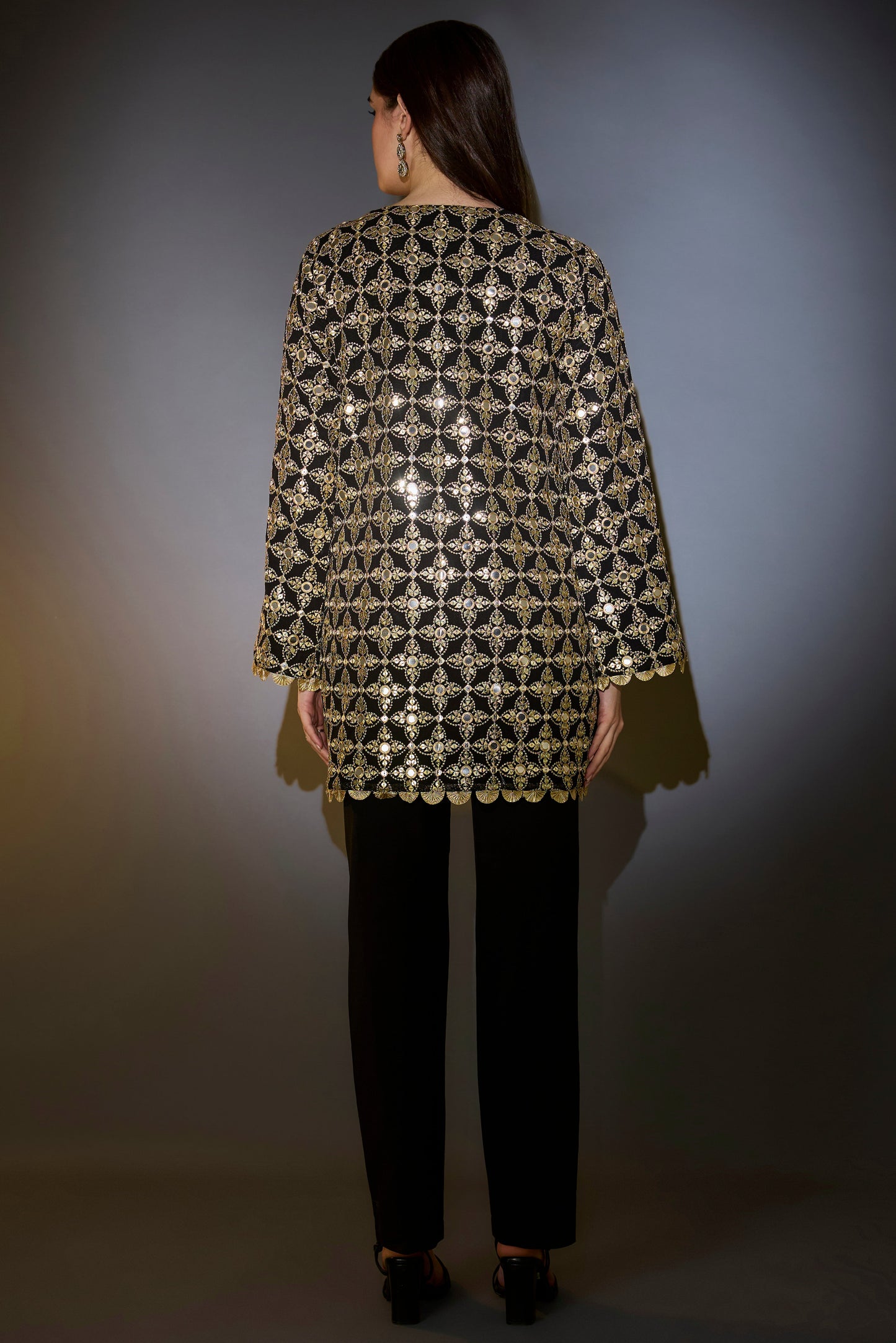 heavy black tunic with intricate mirror and zari work with detailed gota edgings