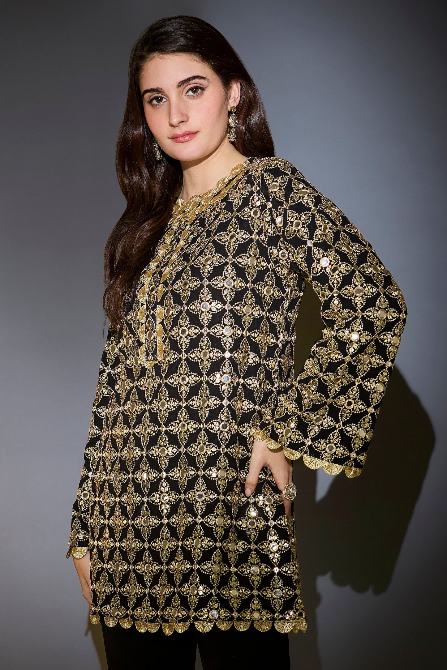 heavy black tunic with intricate mirror and zari work with detailed gota edgings