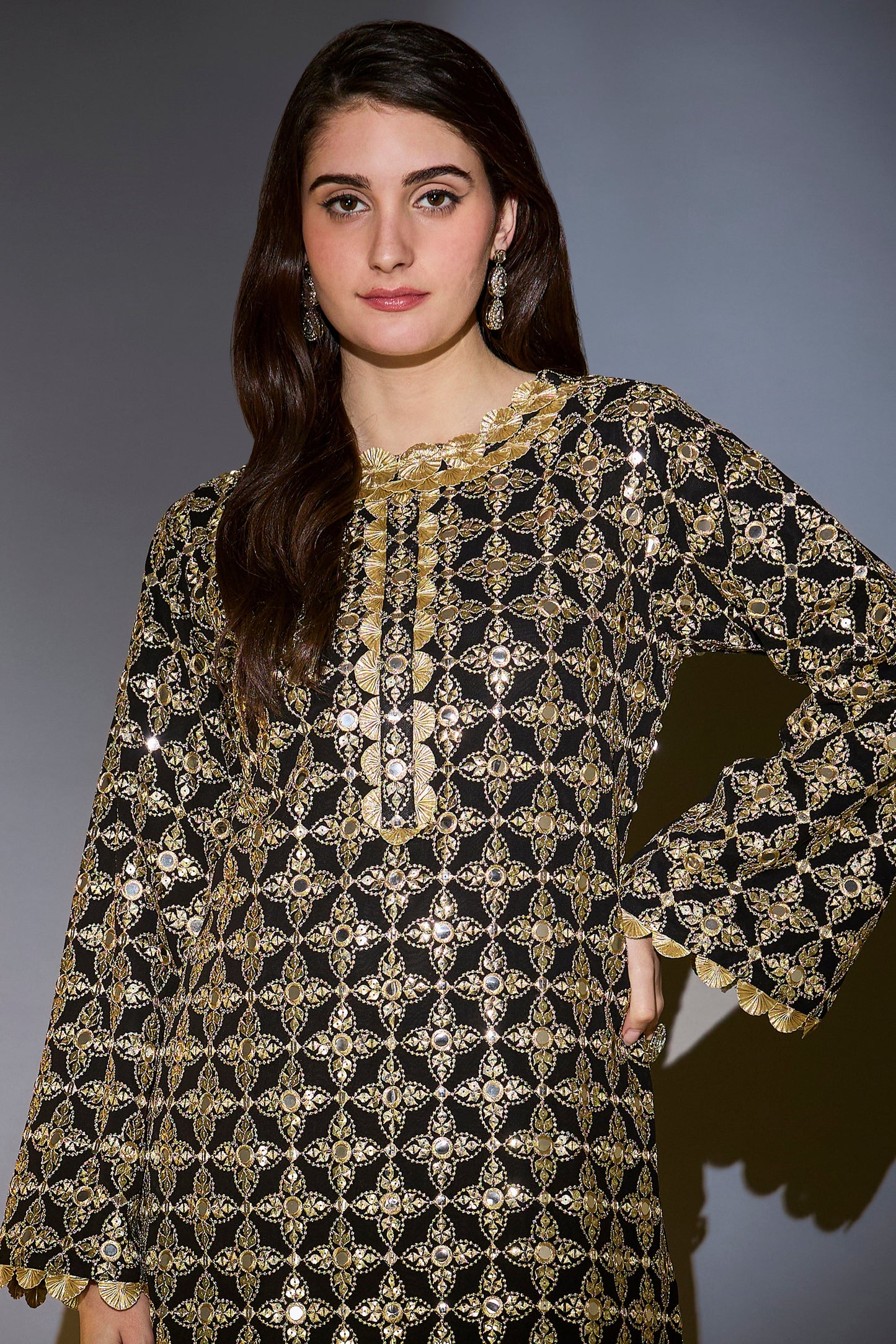 heavy black tunic with intricate mirror and zari work with detailed gota edgings