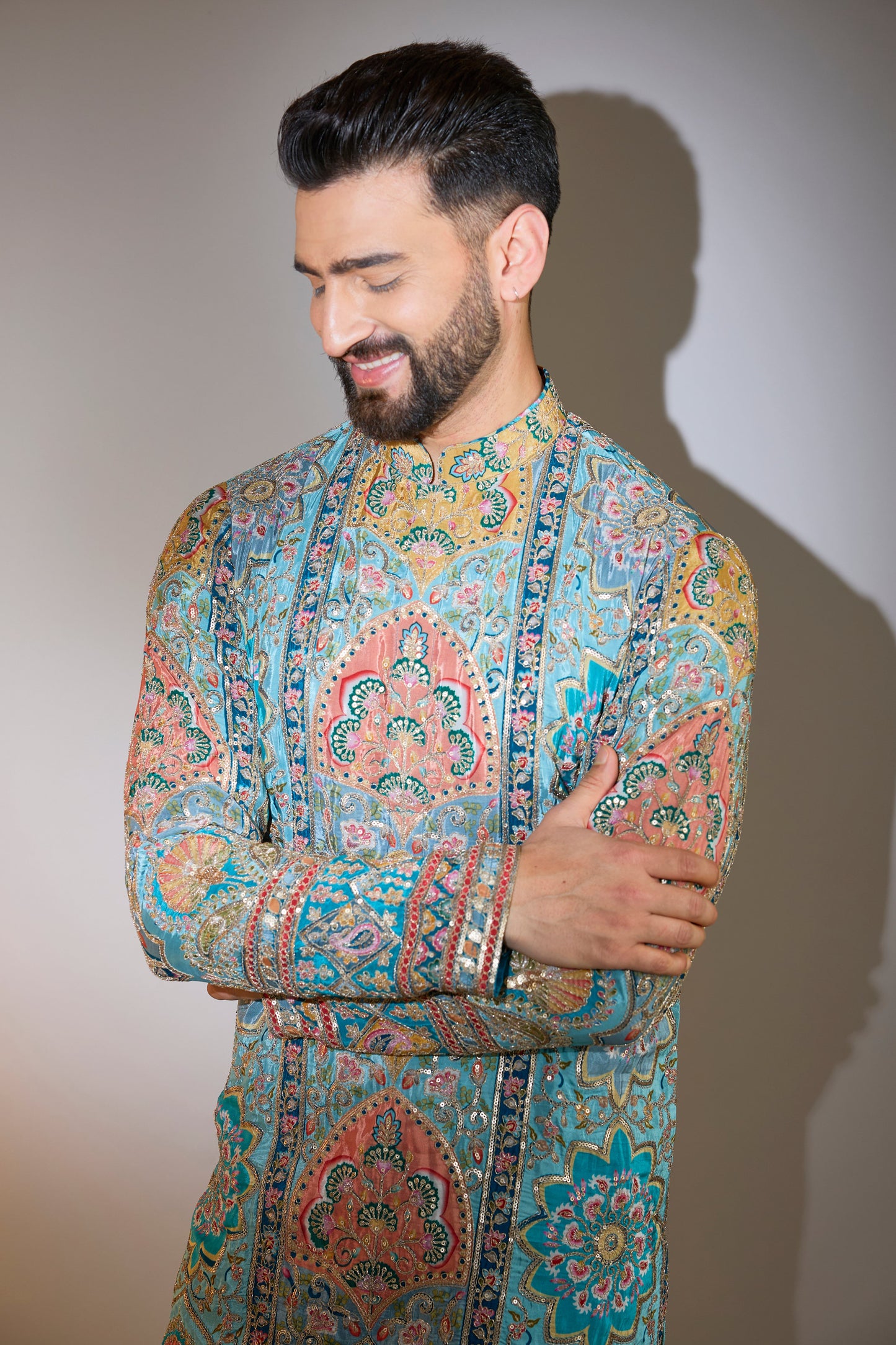 blue embrodried kurta on print with intricate zari detailing