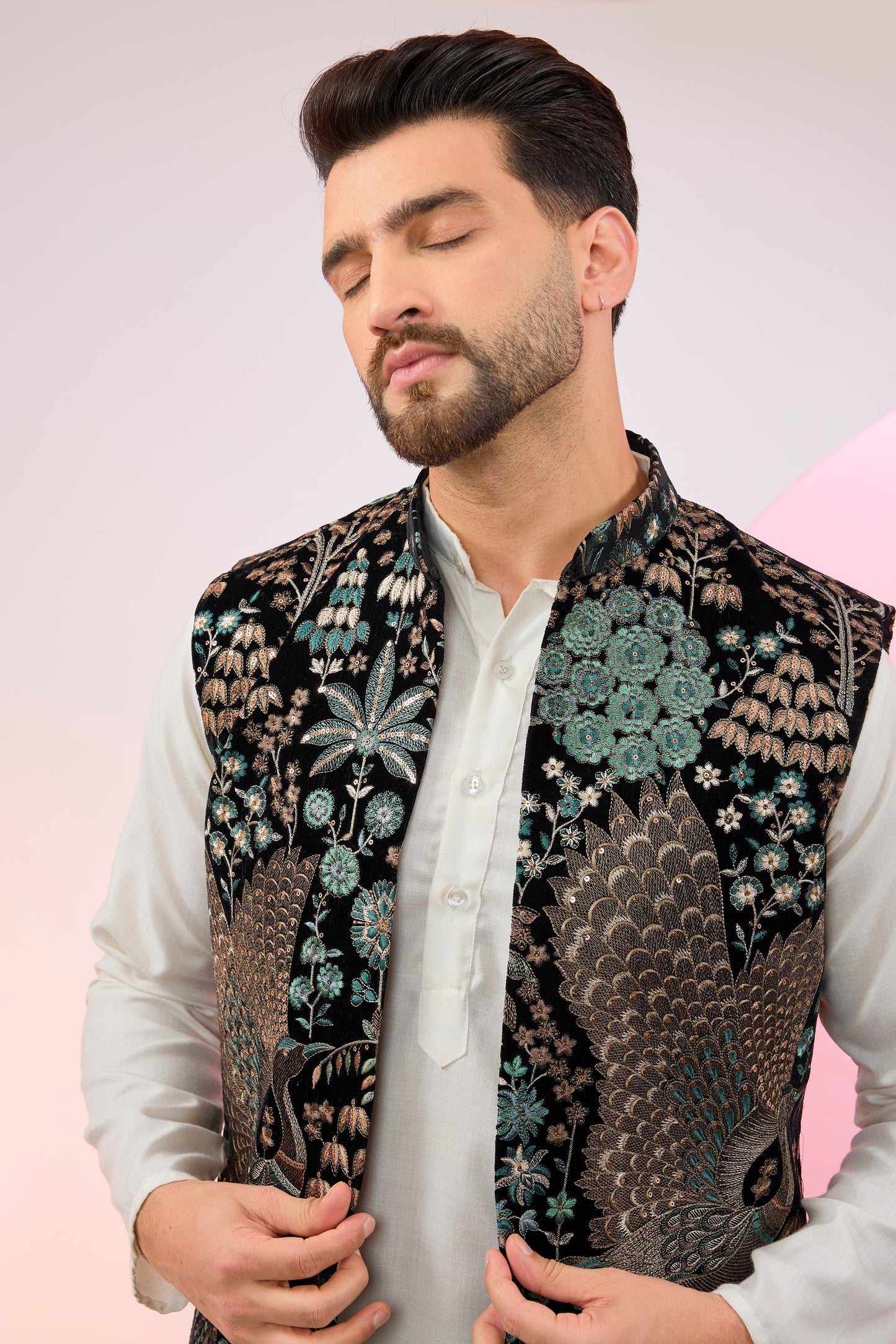 black long jacket on velvet with intricate flora and fauna embroidery