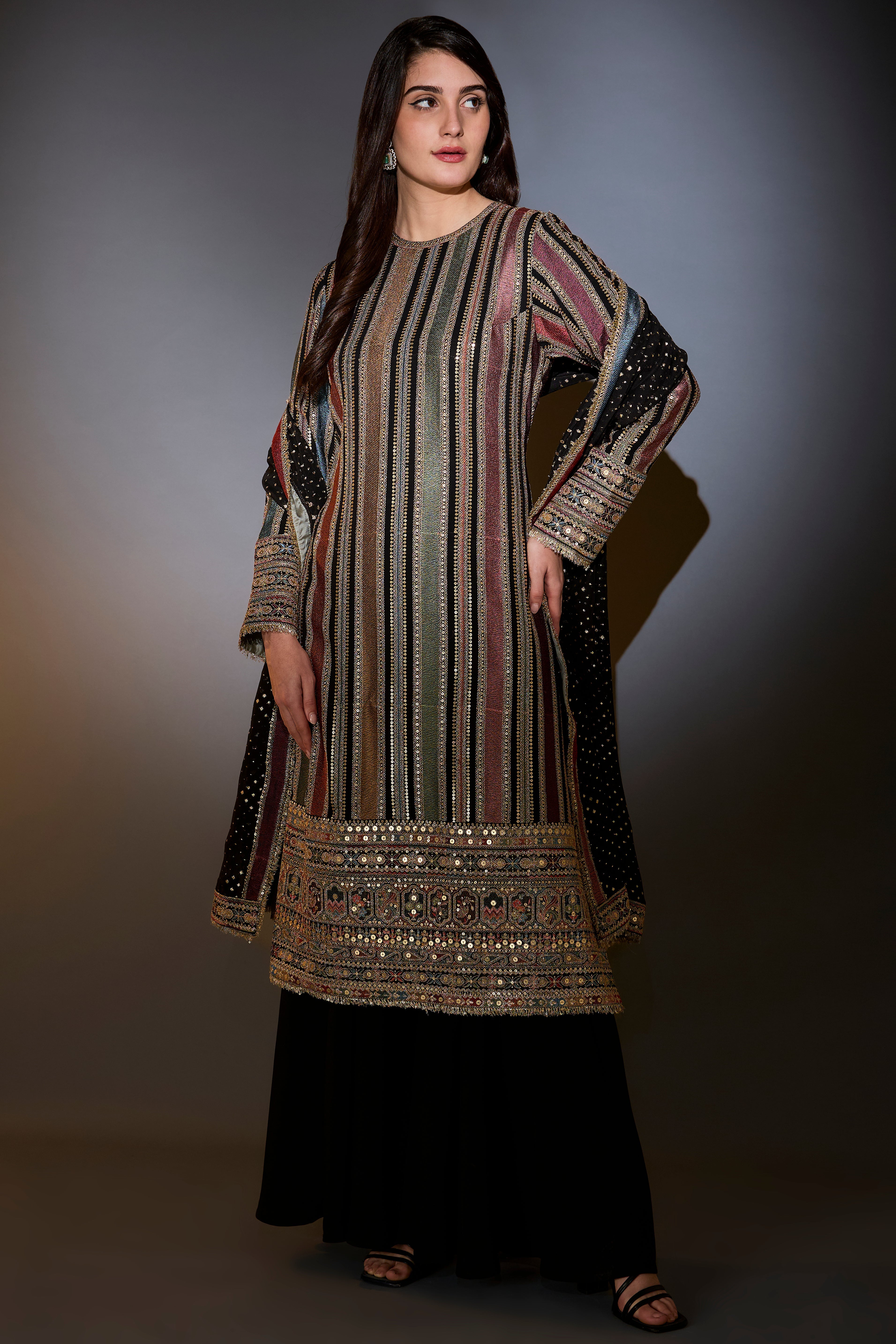 multi color striped suit with intricately done thread and zari work paired with sharara and dupatta