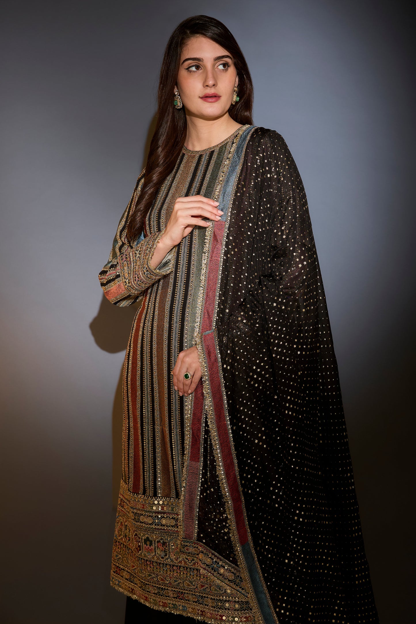 multi color striped suit with intricately done thread and zari work paired with sharara and dupatta