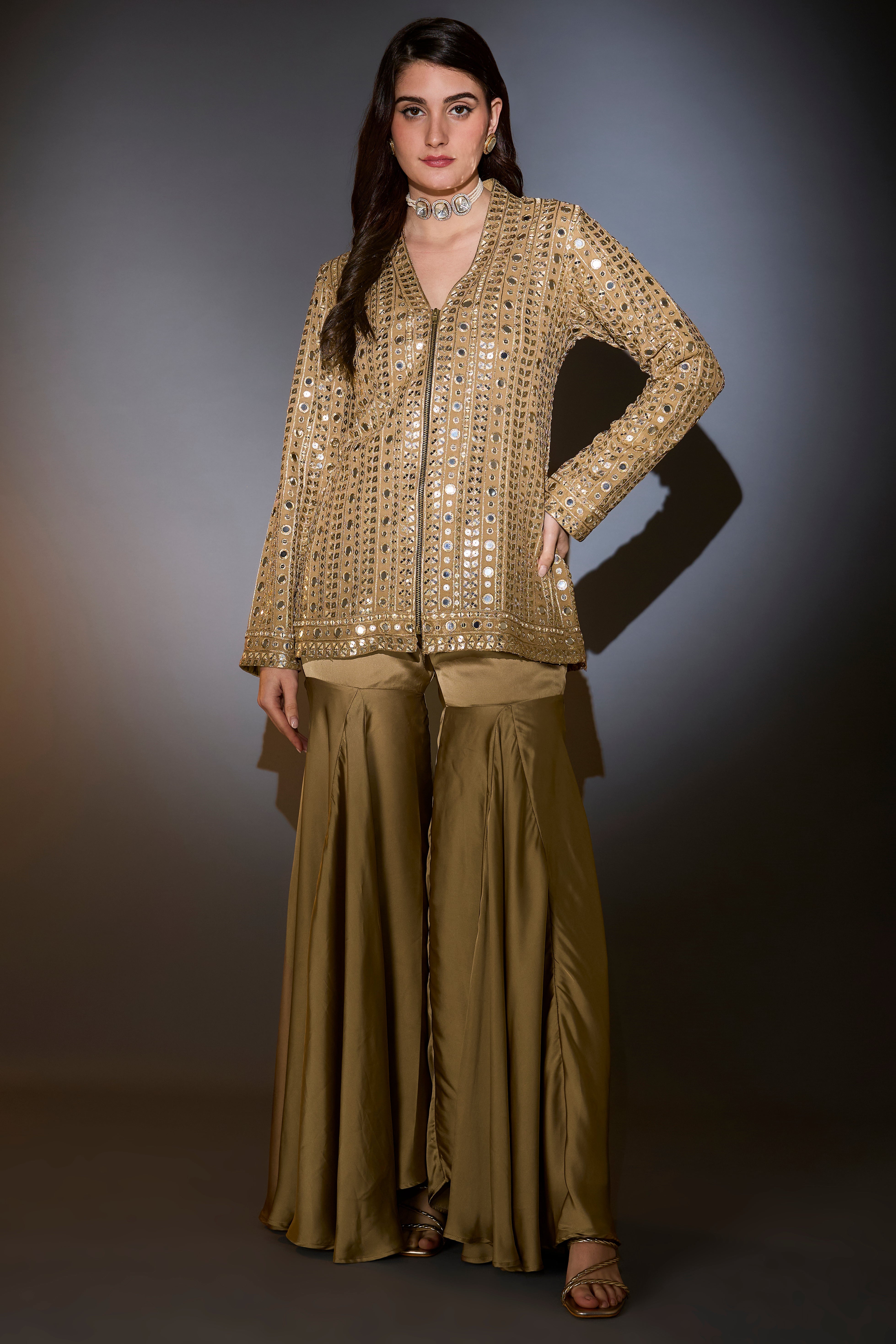 golden copper mirror work garara set complimented with zipper