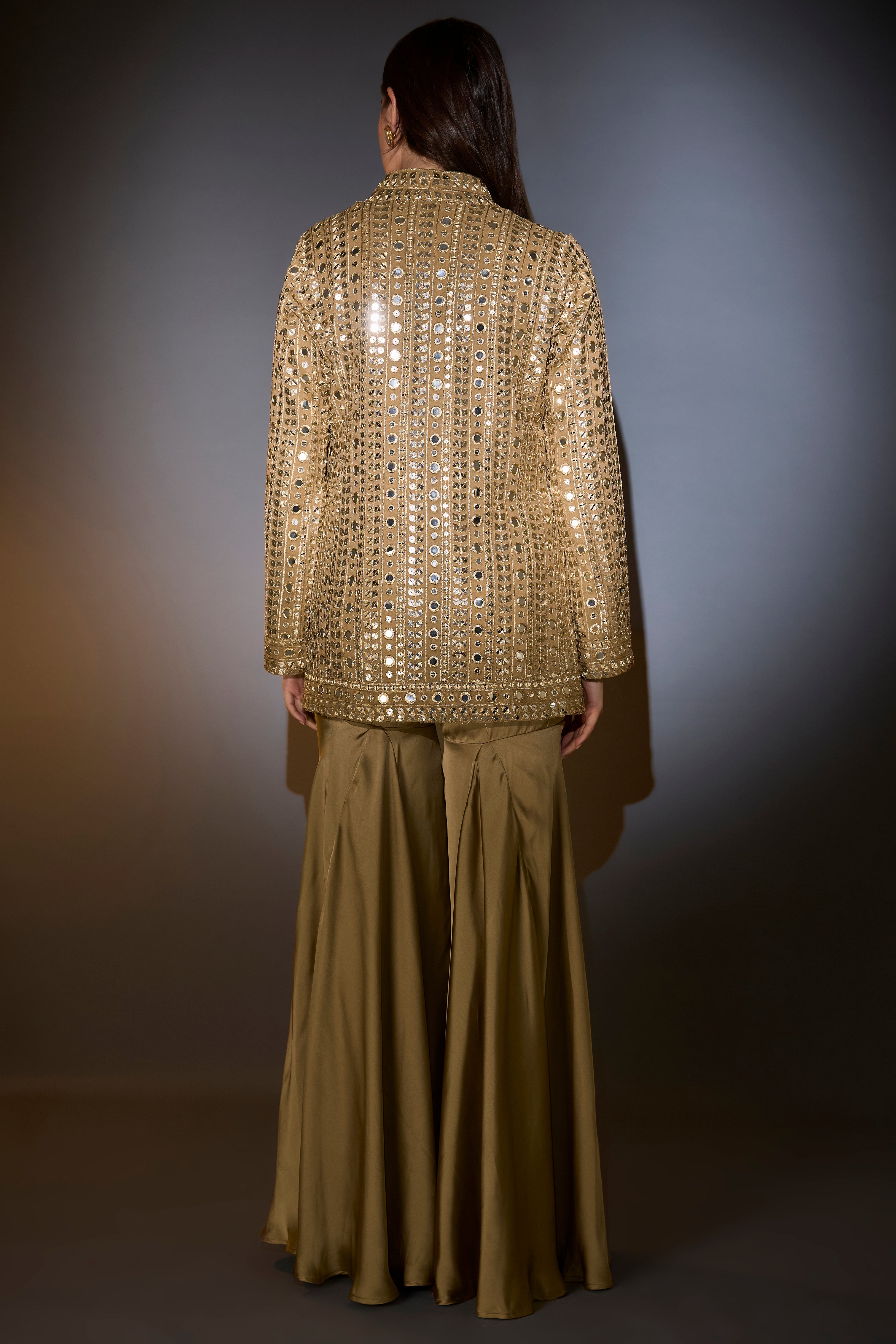 golden copper mirror work garara set complimented with zipper