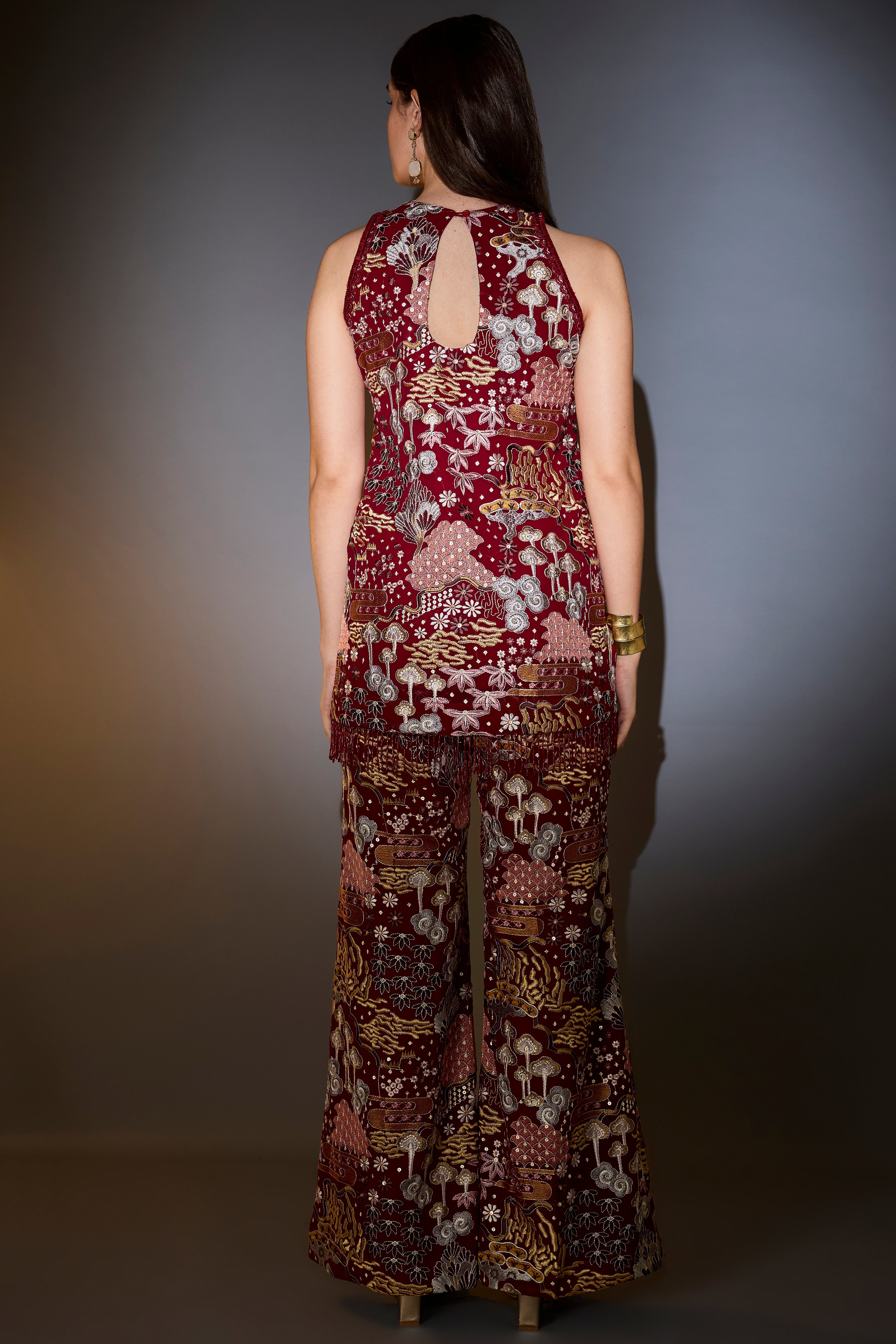 deep red co ord set with intricate multi floral embroidery embellished with bead tassels
