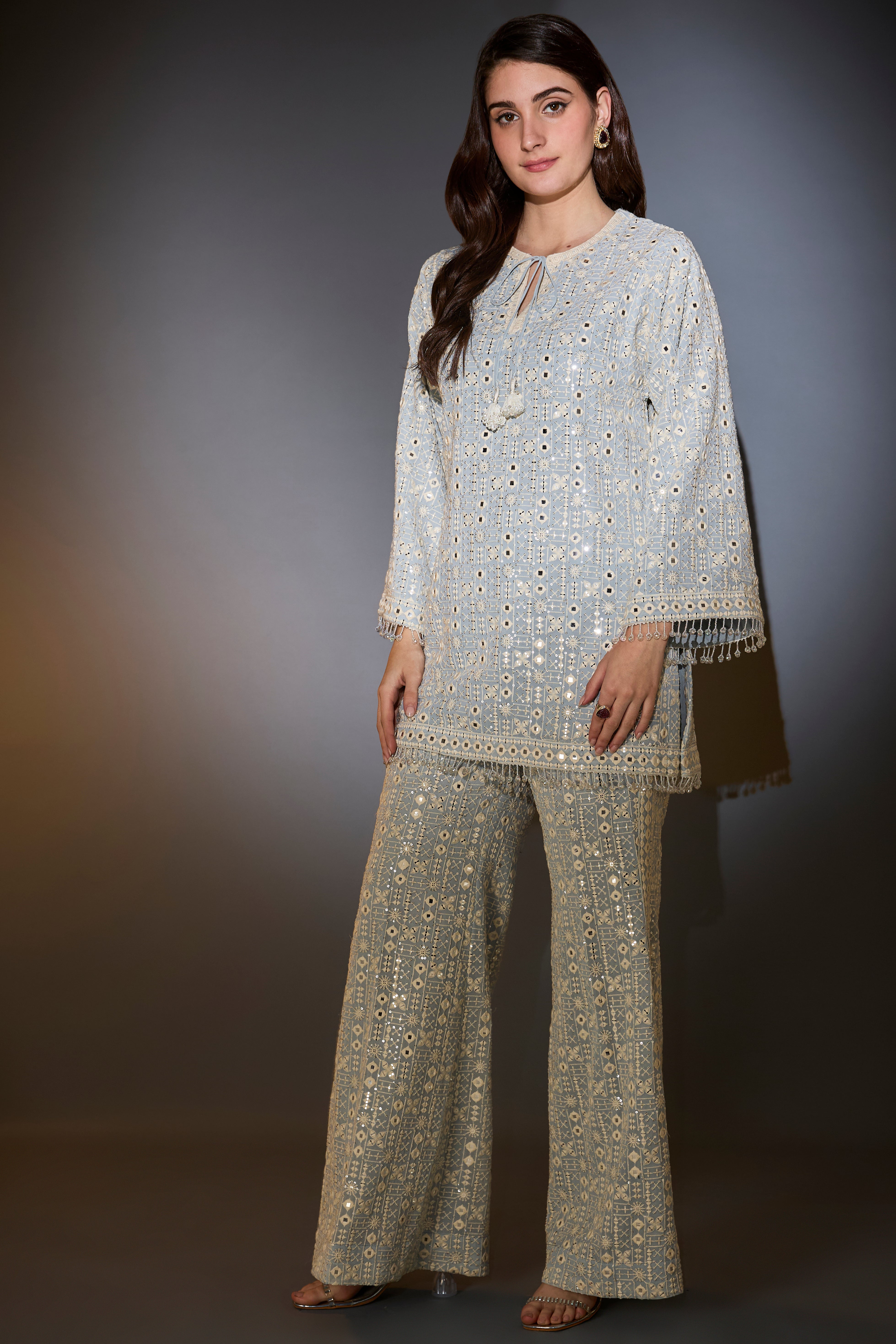 powder blue co ord set with thread mirror and sequin work with detailed edgings embellished tassles