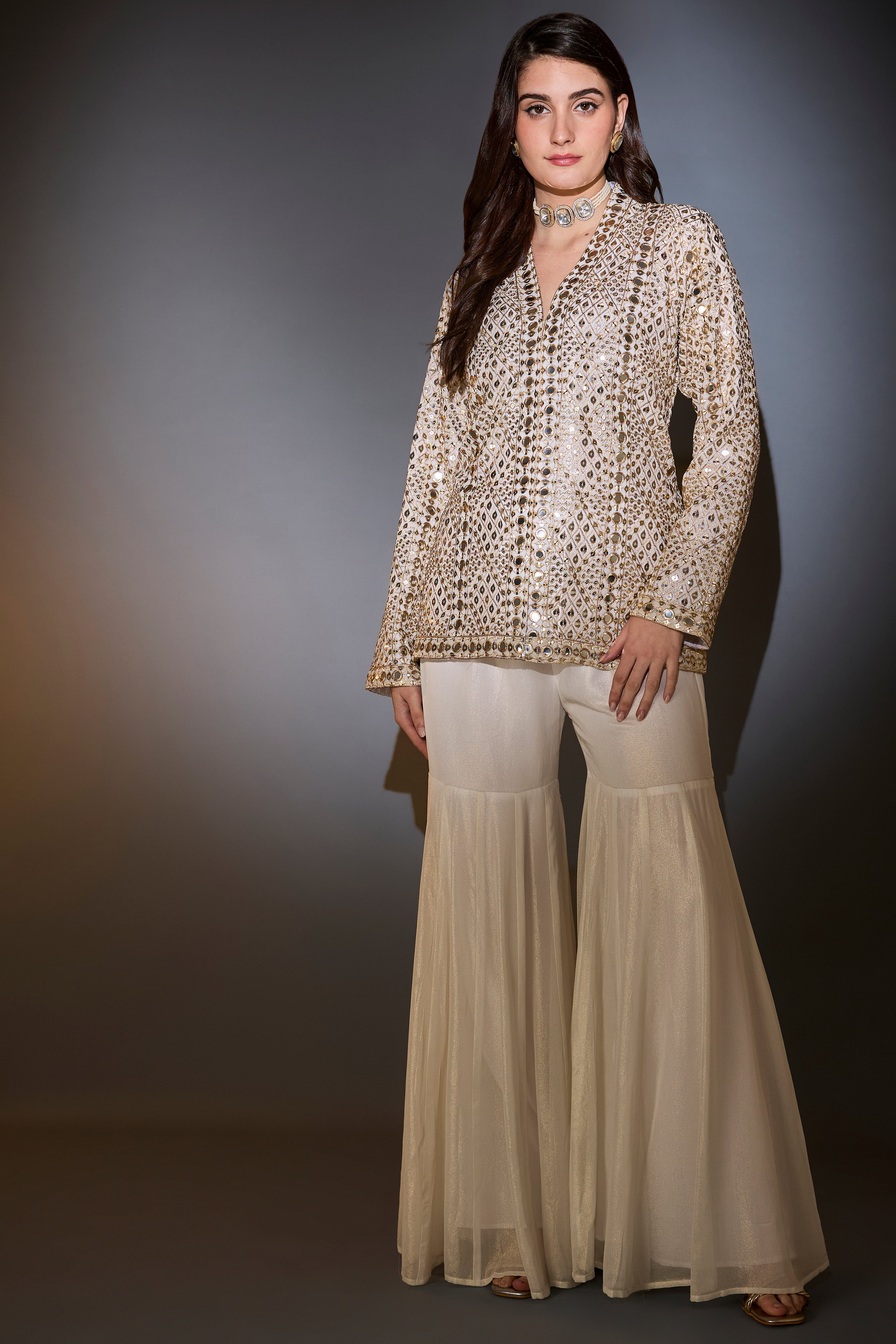 cream garara set with heavy mirror work and zari embroidery