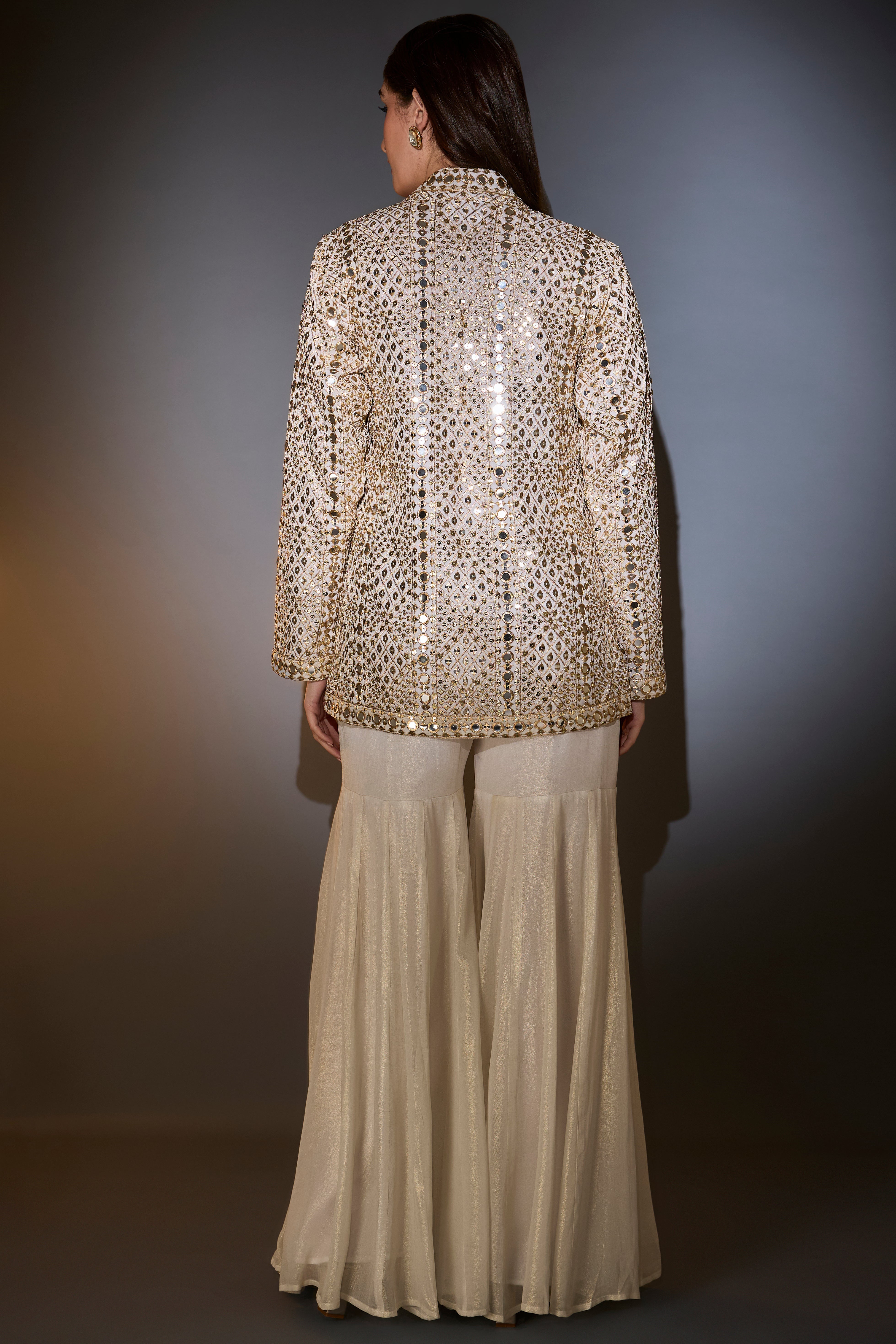 cream garara set with heavy mirror work and zari embroidery