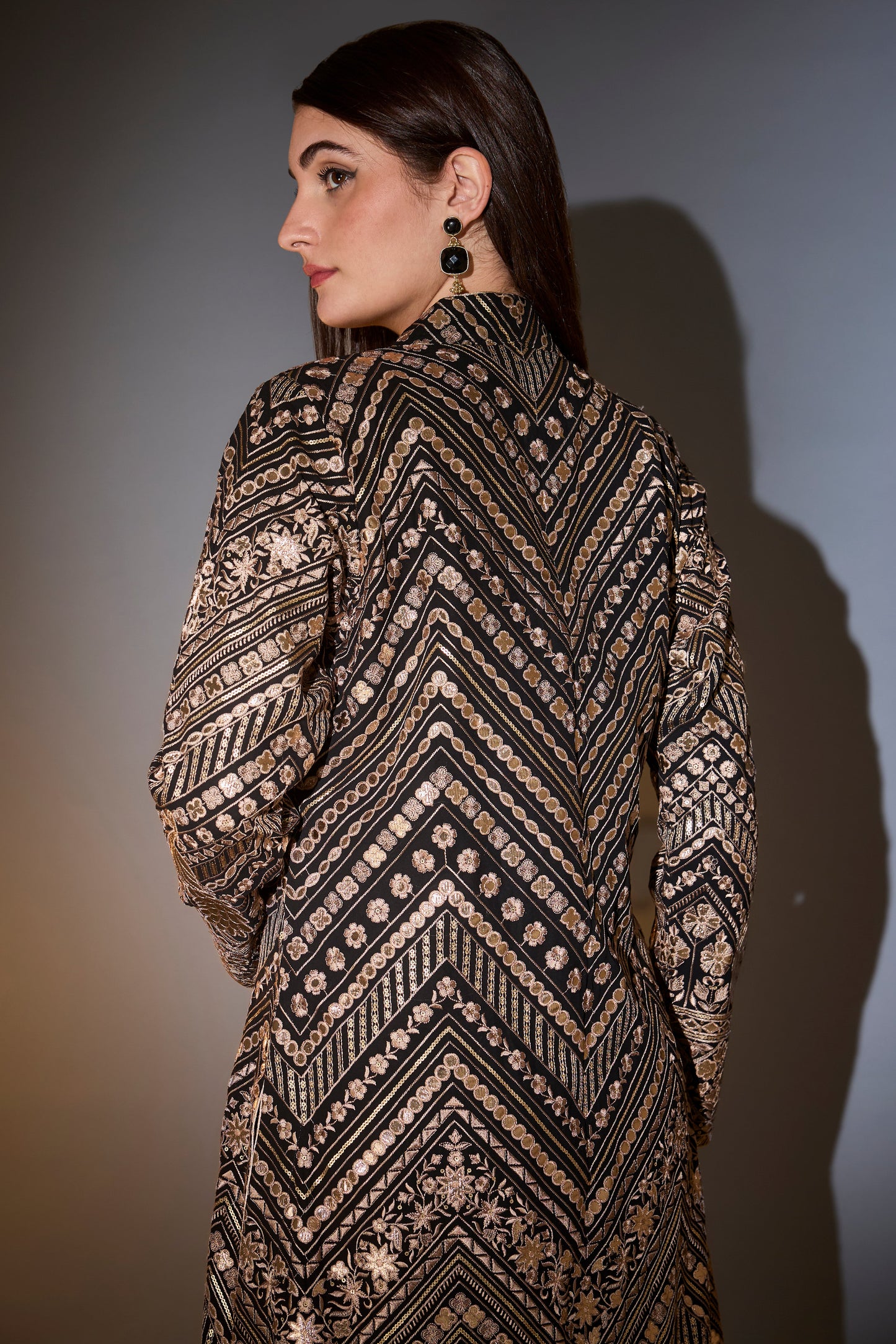 black jacket set with sharara adorned with heavy gold leather patch embroidery