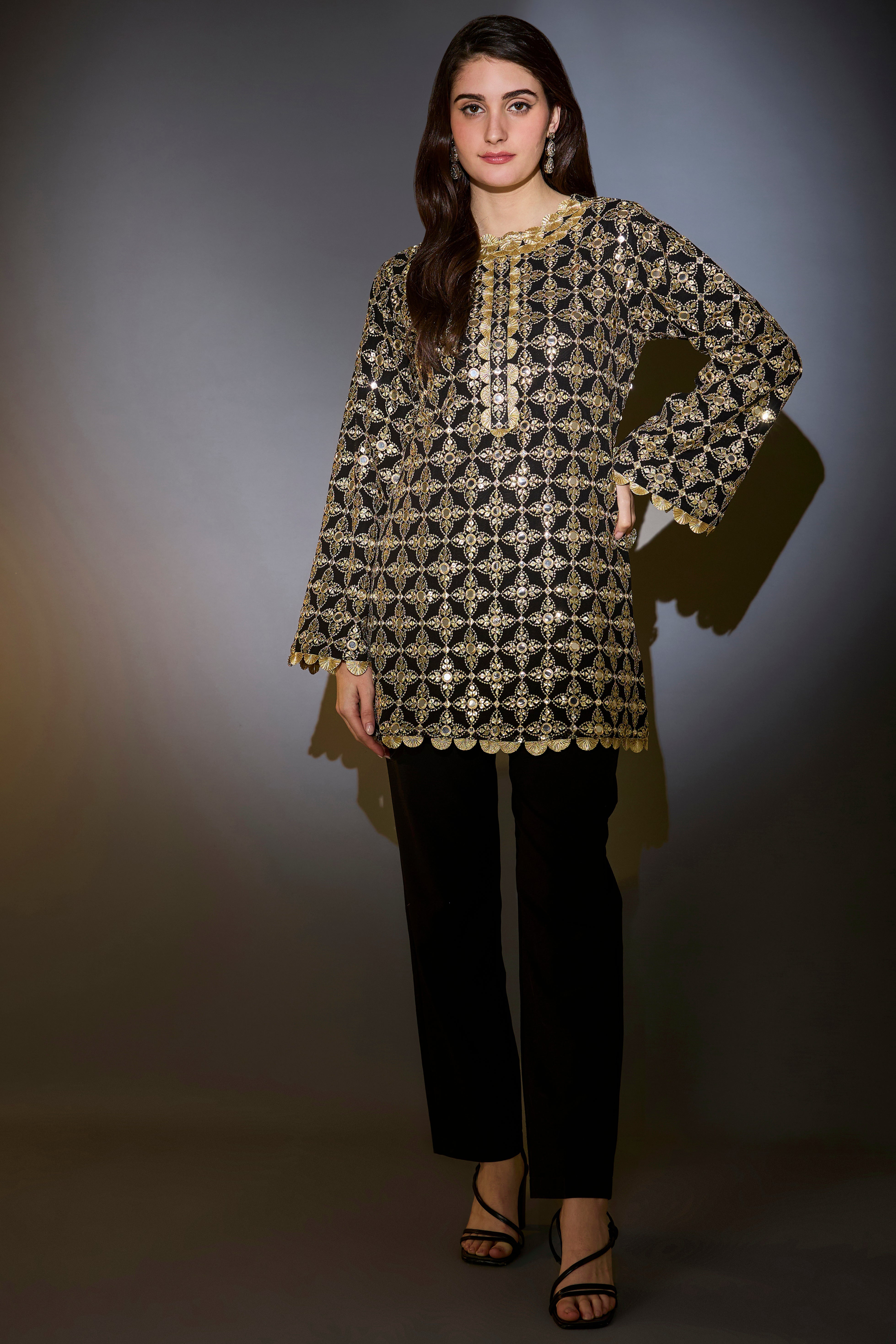heavy black tunic with intricate mirror and zari work with detailed gota edgings
