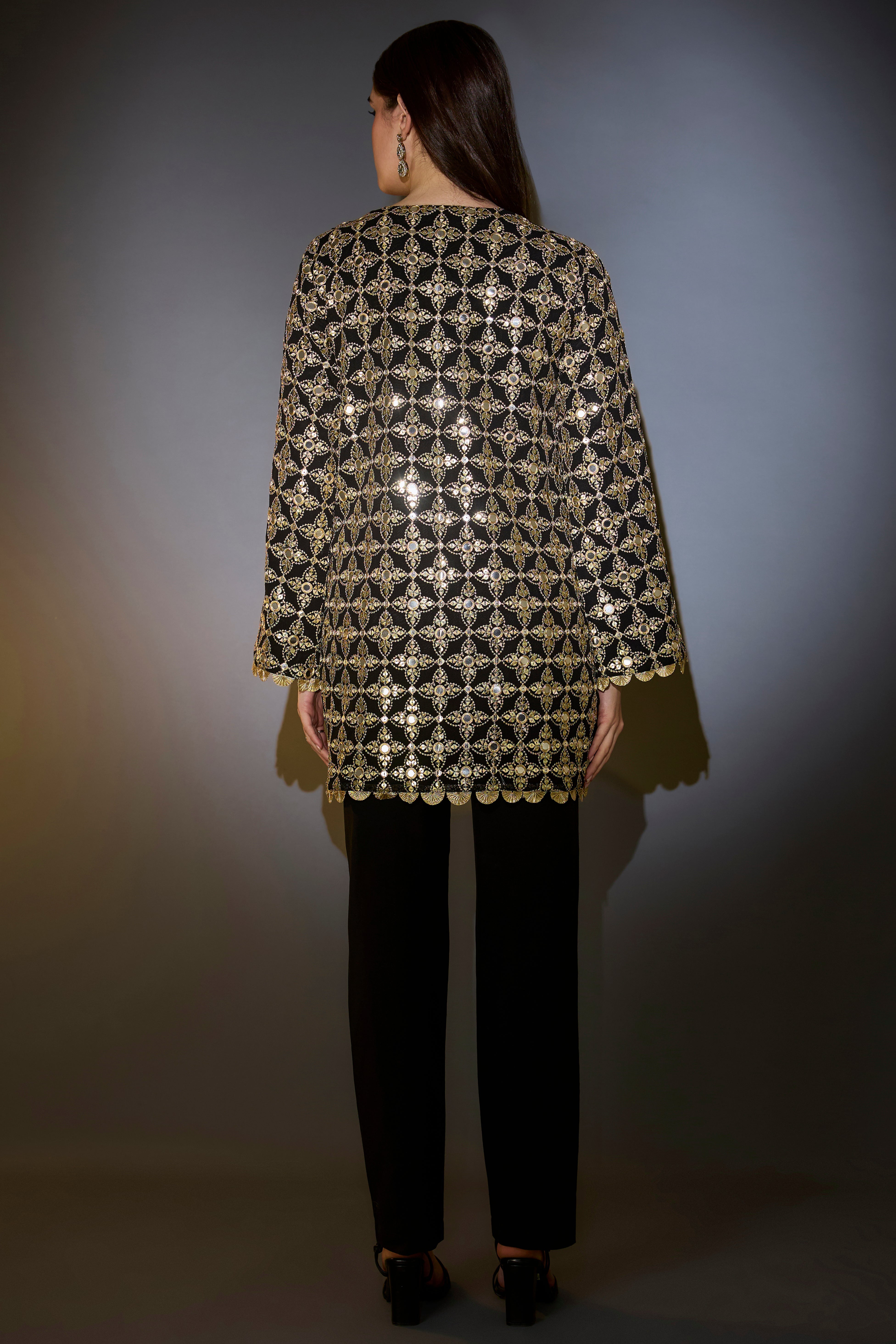 heavy black tunic with intricate mirror and zari work with detailed gota edgings