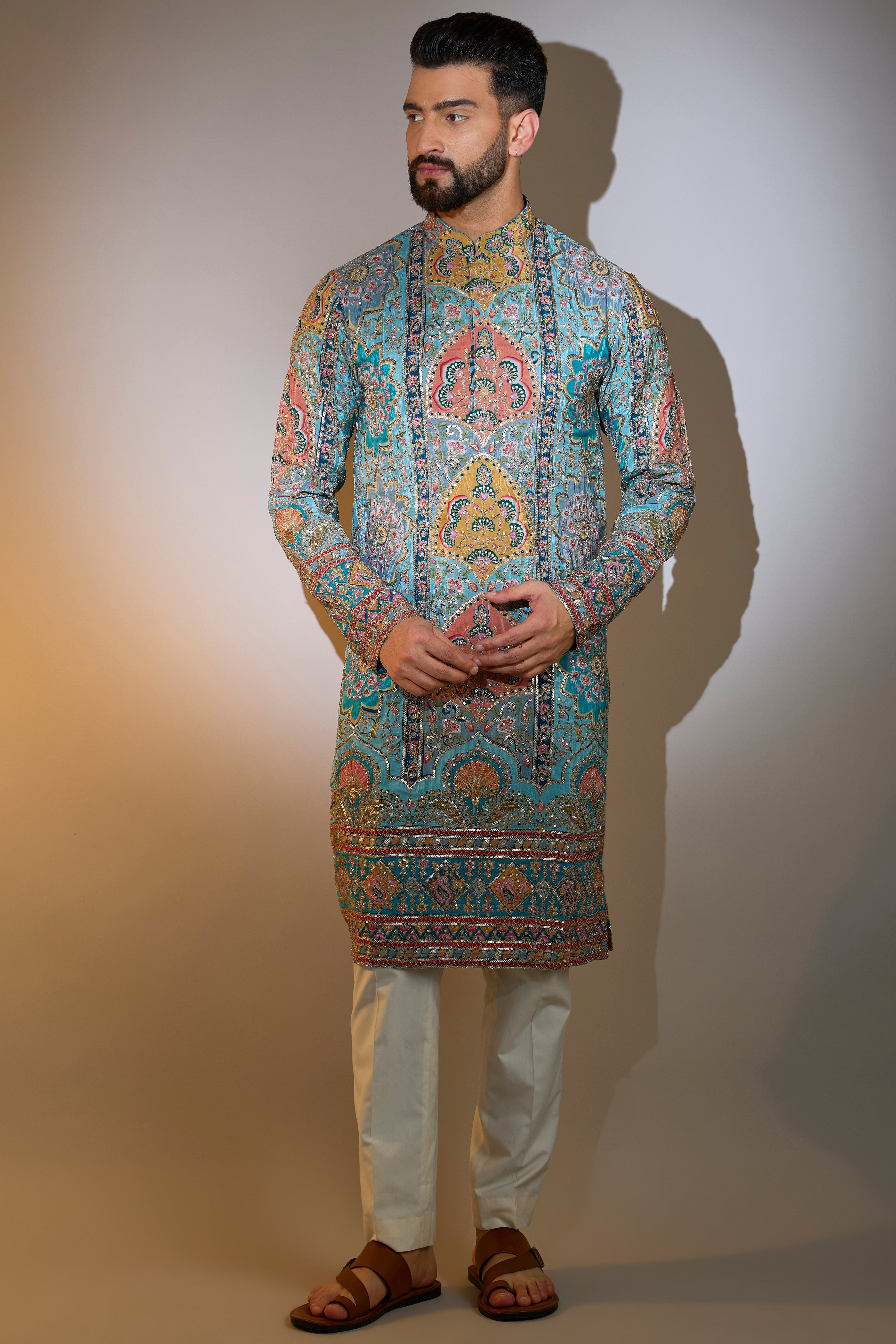 blue embrodried kurta on print with intricate zari detailing