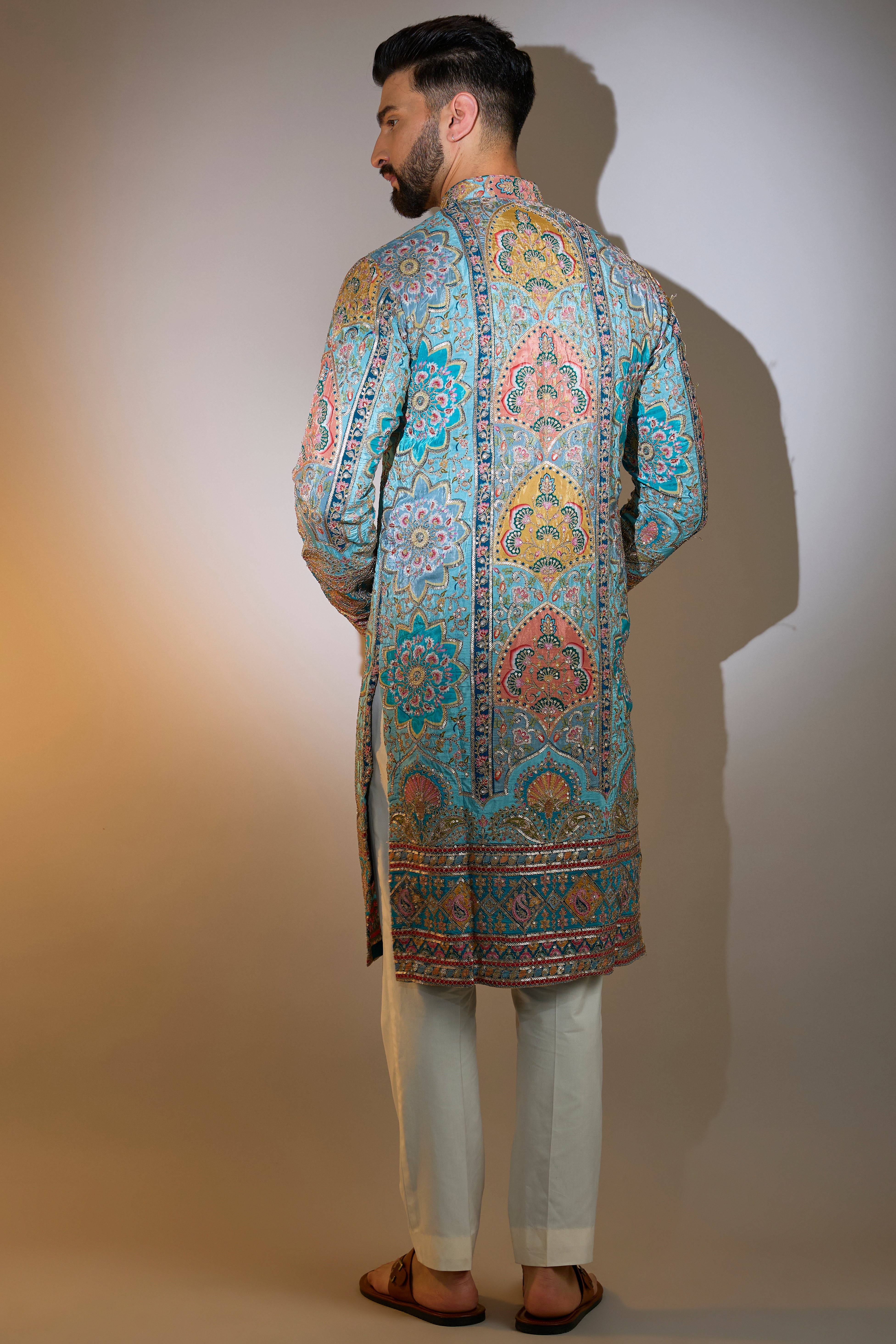 blue embrodried kurta on print with intricate zari detailing