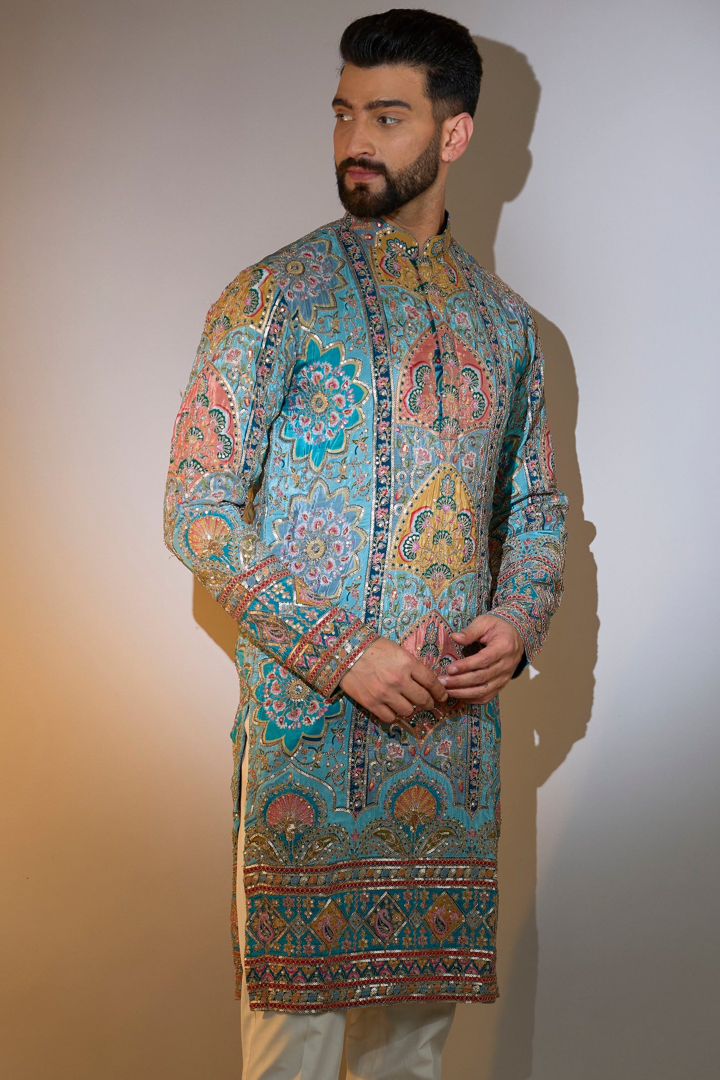 blue embrodried kurta on print with intricate zari detailing