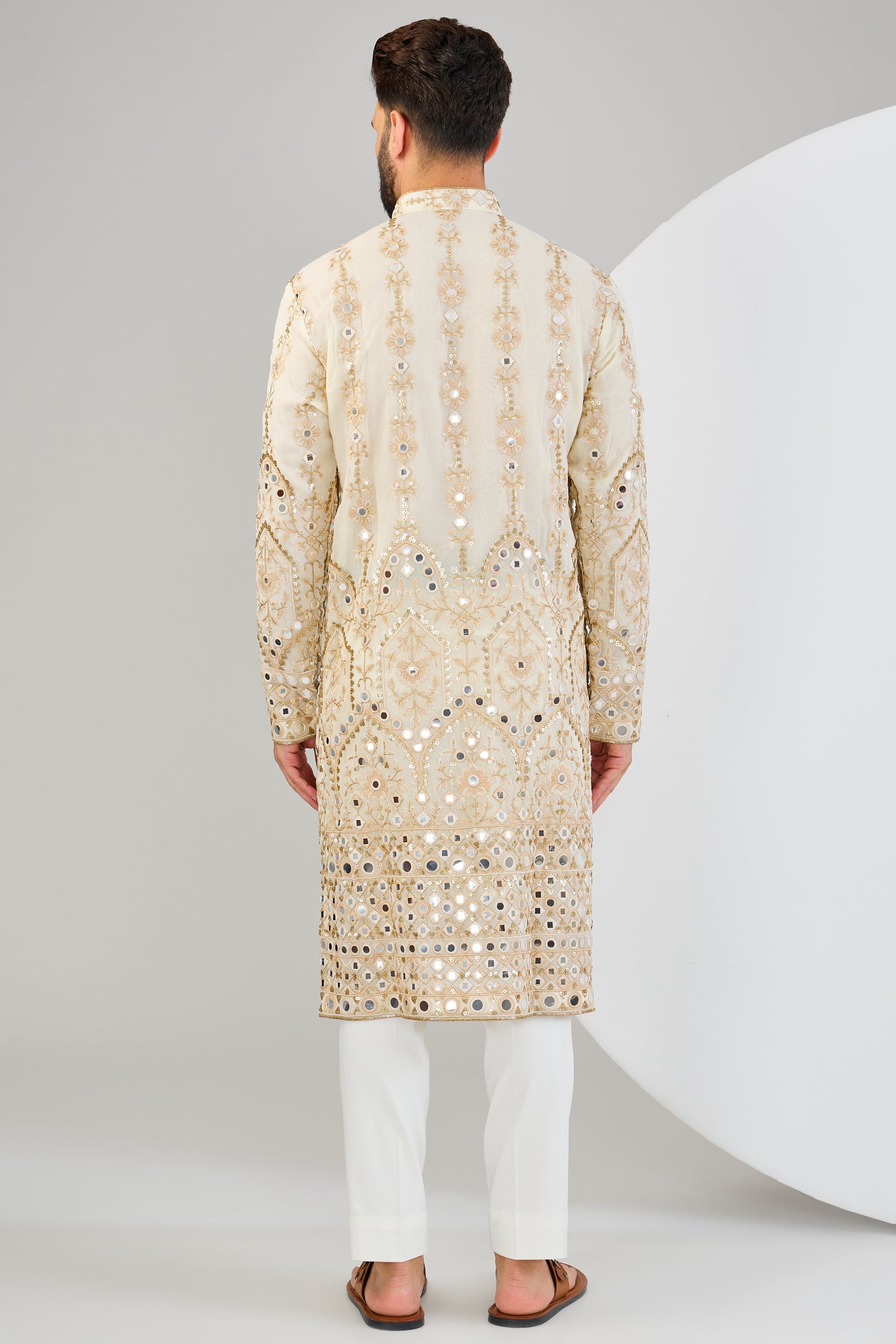 Cream mirror work kurta with detailed neckline and ghera with gold zari highlighting. - kasbahmen