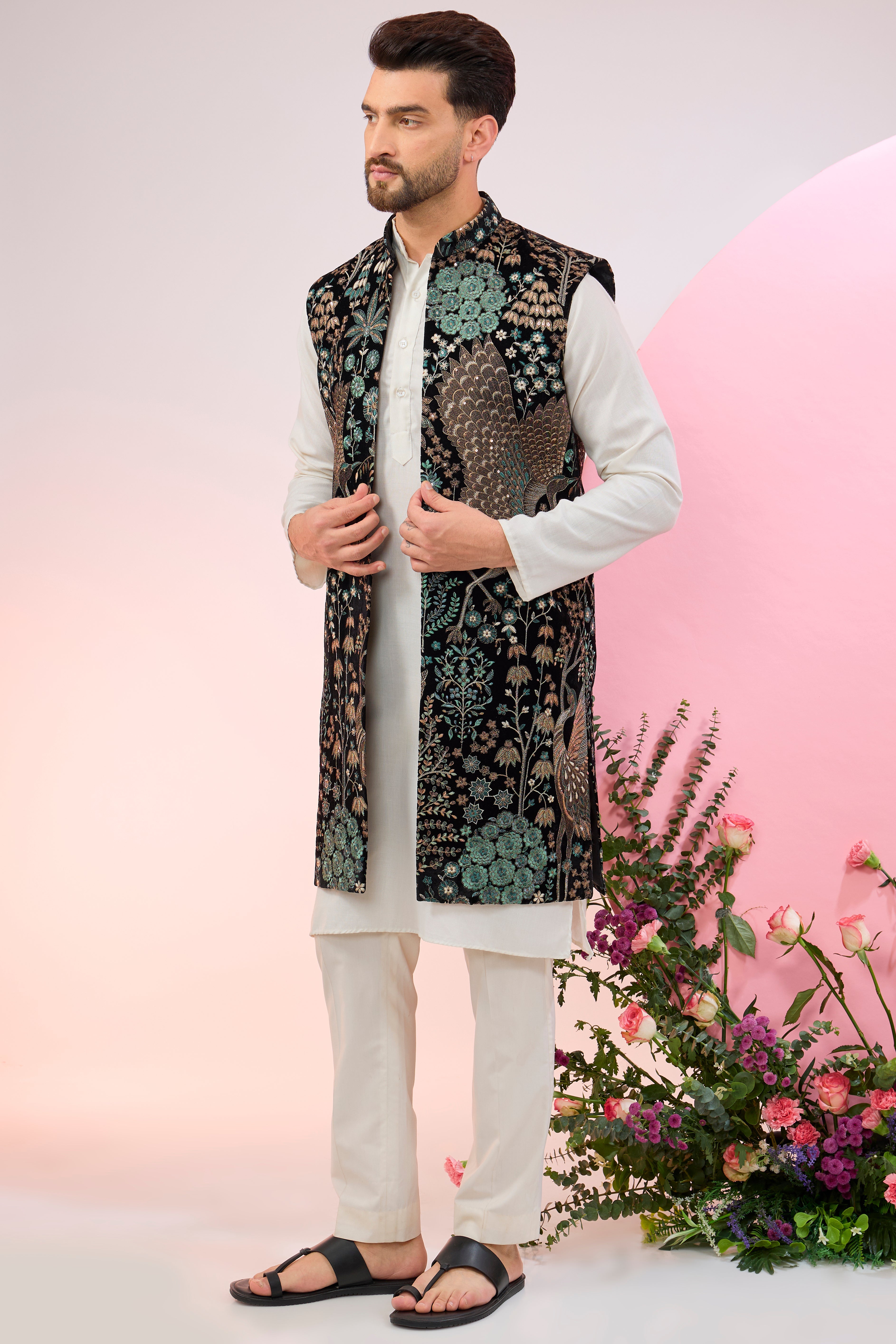 black long jacket on velvet with intricate flora and fauna embroidery