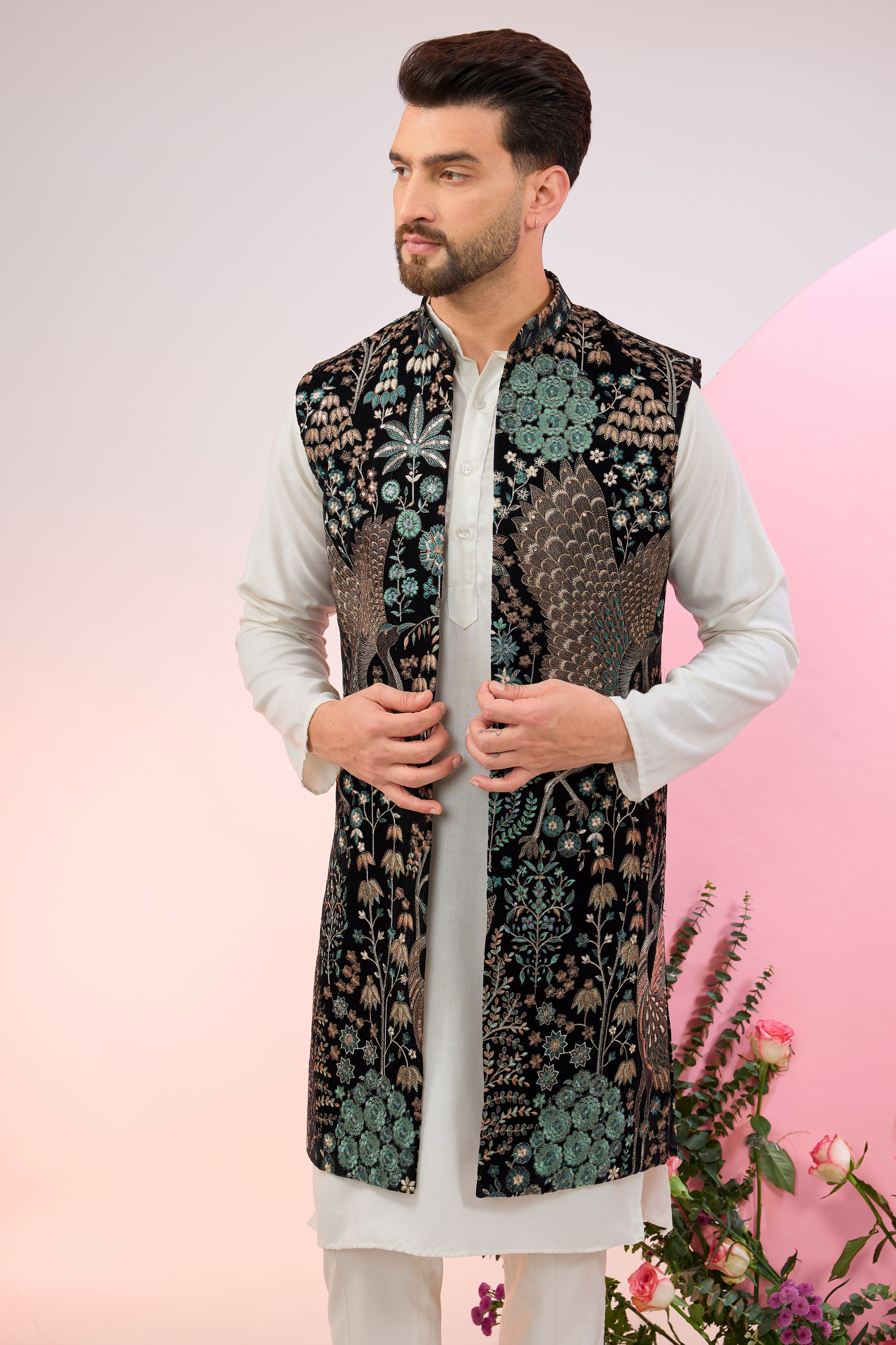 black long jacket on velvet with intricate flora and fauna embroidery