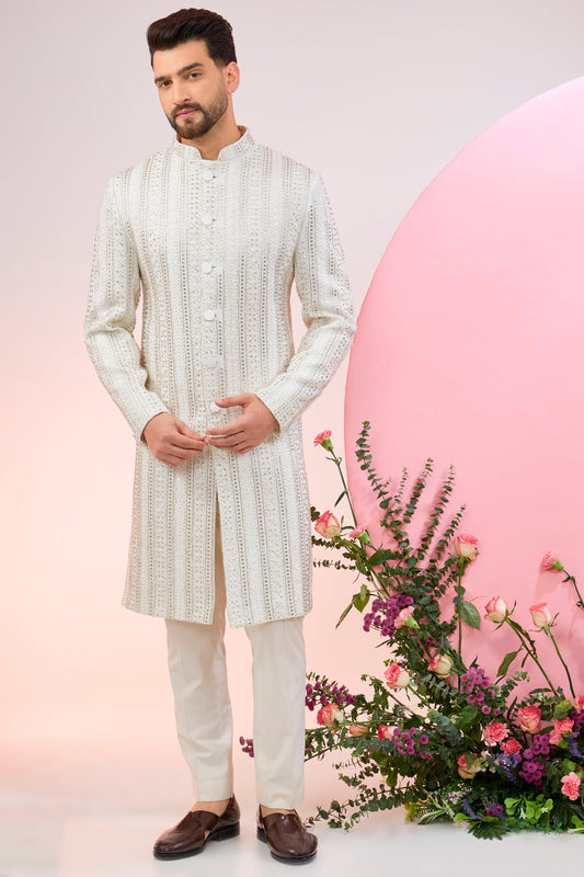 white sherwani with intricate cut dana embroidery
